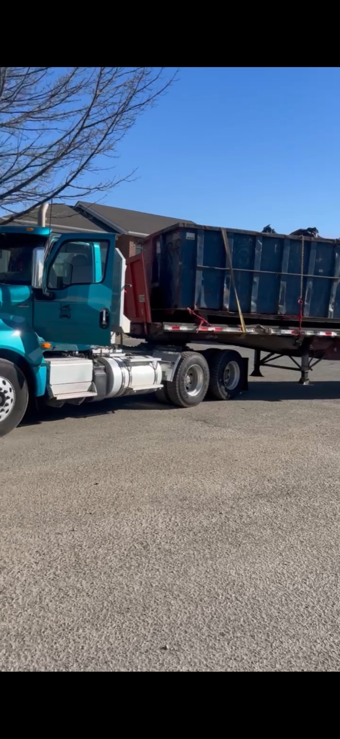 PPMI truck loaded with scrap and debris for hauling